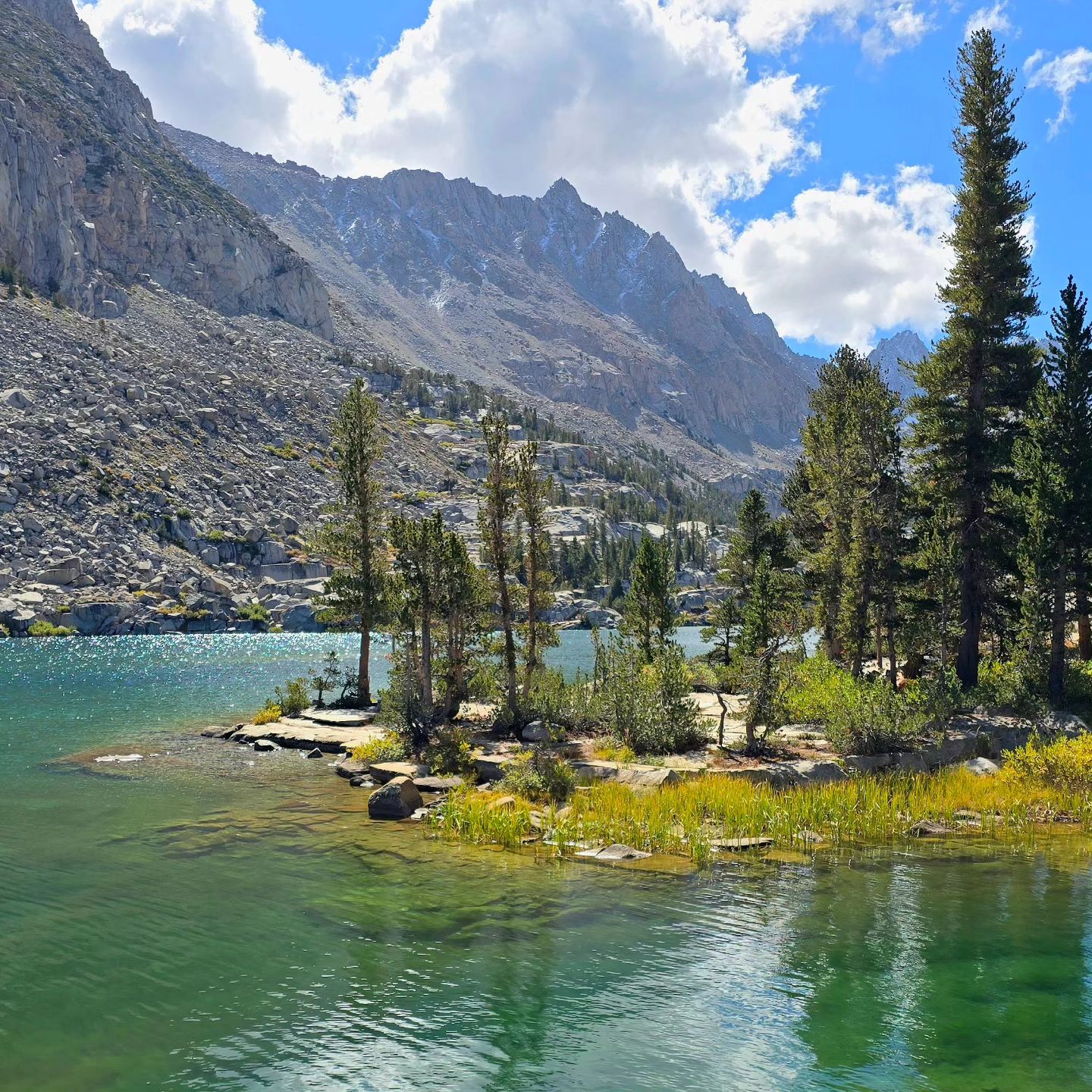 Lake Sabrina after a heavy winter with lots of water and green grass