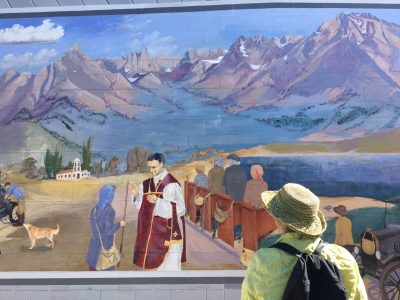 image of a woman gazing at a mural 