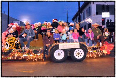 Preschoolers on a brightly lit parade float