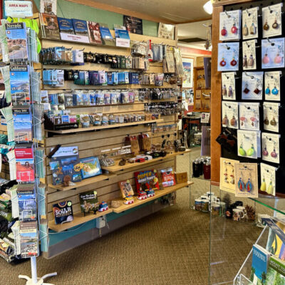 Maps, souvenirs, jewelry at gift shop in visitor center, Bishop, CA.