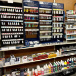 A display of watercolor paints, brushes, pads, and other art supplies graces the shelves of a charming art store in Bishop, California. visit bishop