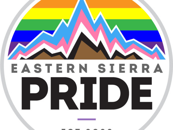 Logo for Eastern Sierra Pride featuring mountains adorned with rainbow and pride flag colors, with "EST. 2022" text below. Celebrating the vibrant diversity of Bishop, California. visit bishop