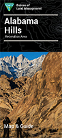 Brochure cover for Alabama Hills Recreation Area with rock formations and distant mountains, features two hikers. visit bishop