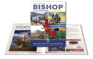 Cover of a travel guide for Bishop, California, showcasing maps, scenic images of the Eastern Sierra, and highlighted tourist activities. visit bishop