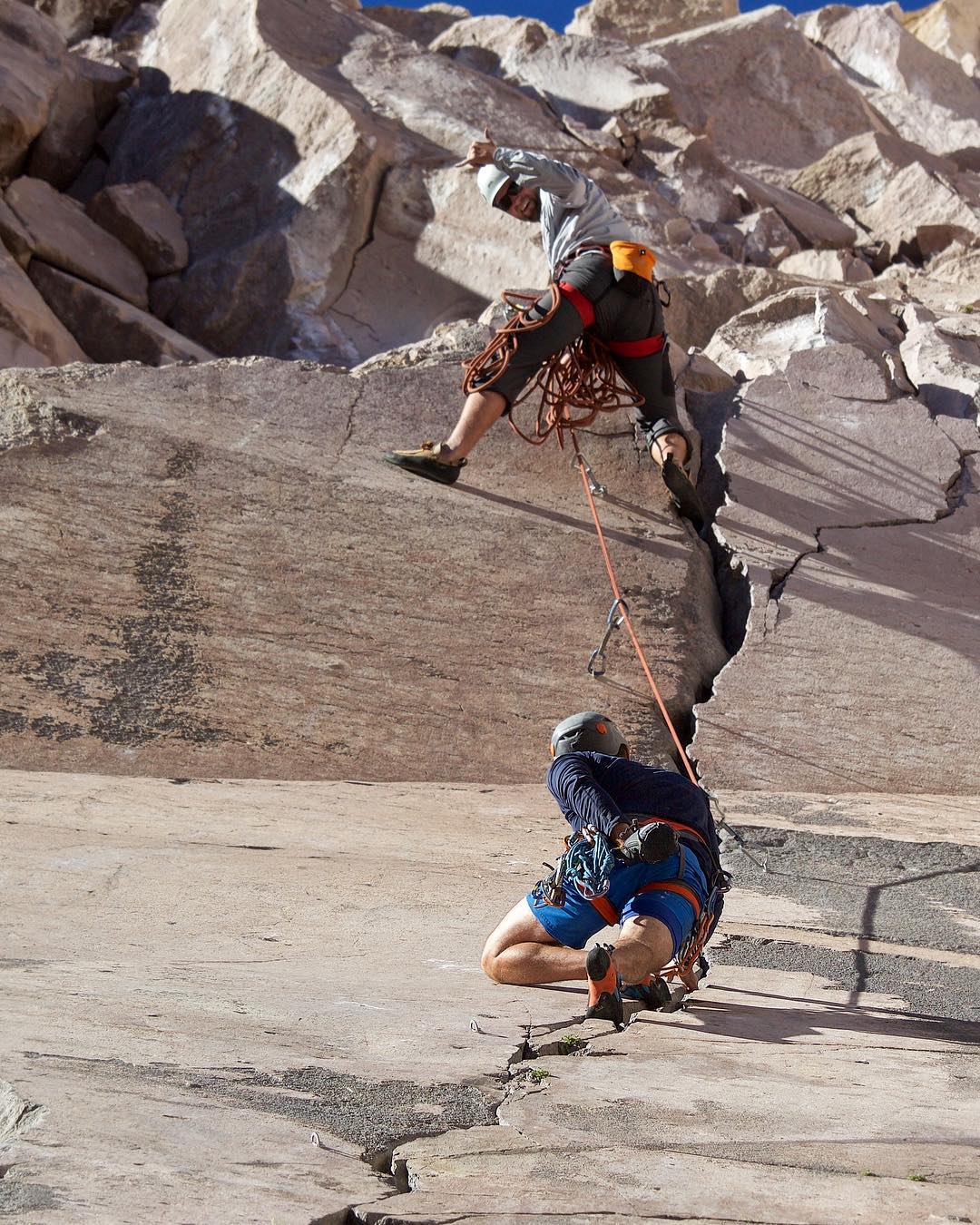 Two rock climbers climbing up a pitch in the Owens River Gorge